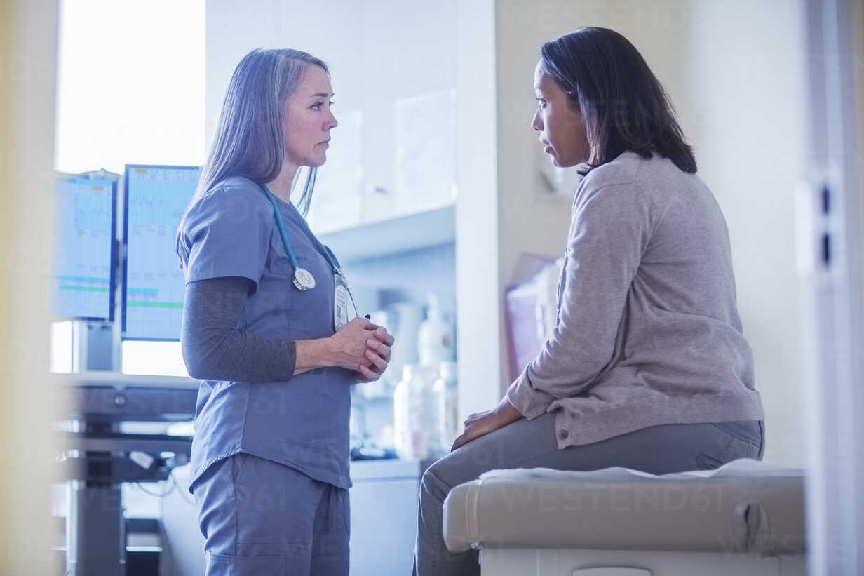 Doctor consulting with patient in examination room